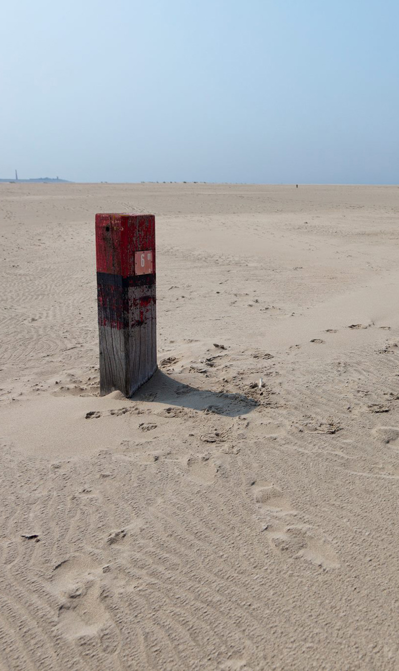 Paaltje op het strand